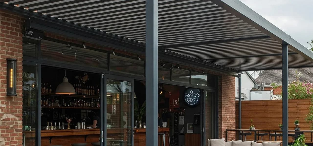 Commercial aluminium pergola covering an outdoor hospitality area