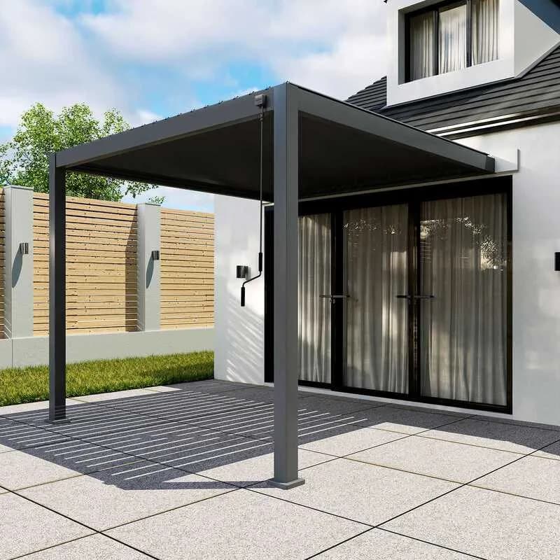 Wall-mounted grey aluminium pergola fitted above patio doors