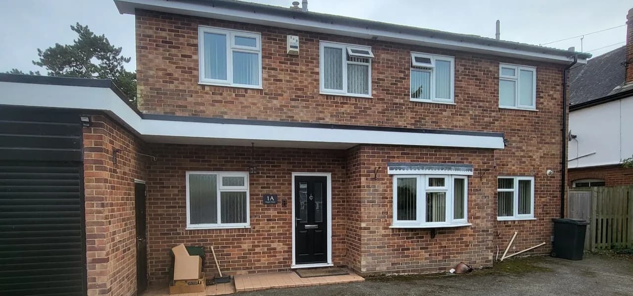 Completed fascia and guttering work on a brick home